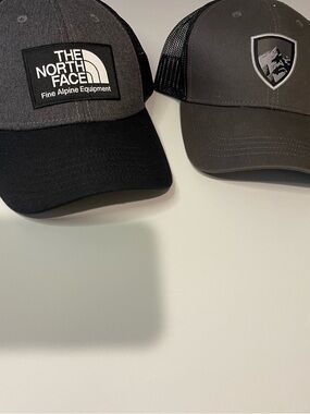 2 SnapBack hats, 1 Kuhl, 1 The North Face, both like new